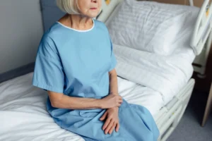 sad woman in nursing home